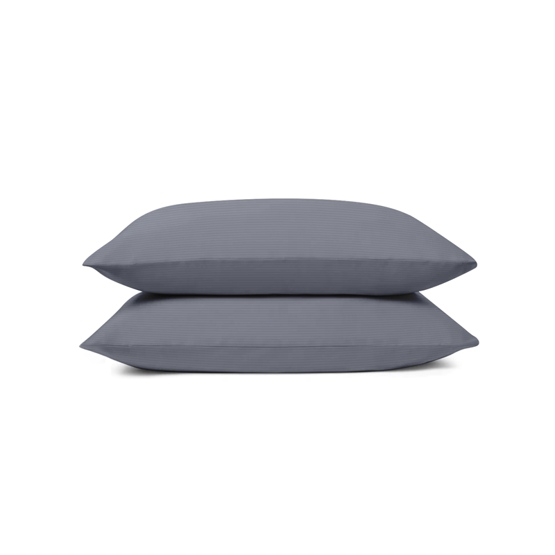 A pair of grey pillows on a white background